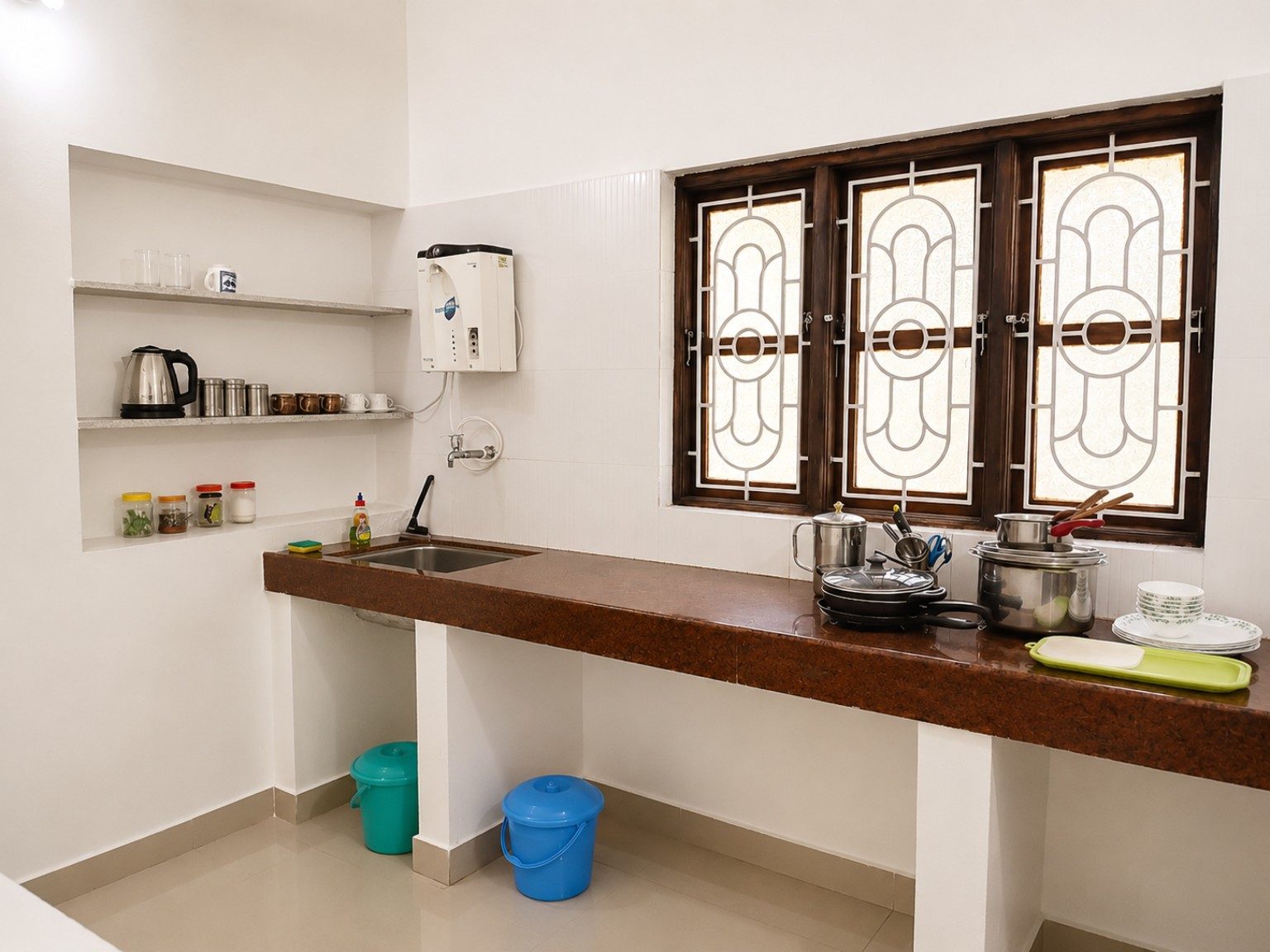 Kitchen counter with sink and cooking facilities